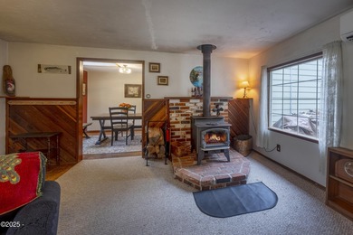 Enjoy the feel of country living on this .60-acre property just