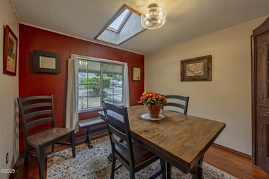 Enjoy the feel of country living on this .60-acre property just