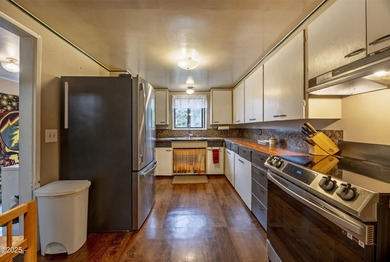 Enjoy the feel of country living on this .60-acre property just