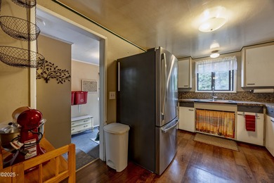 Enjoy the feel of country living on this .60-acre property just