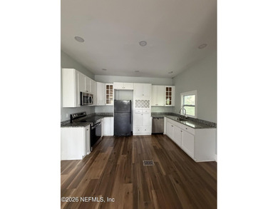 Potential of turning it into 2 family home! Located in the - photo 7