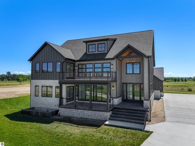 Commanding panoramic views of East Grand Traverse Bay from - photo 8