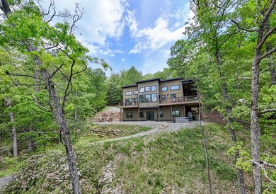 Secluded on Fontana Lake, this modern-mountain, custom-built - photo 7