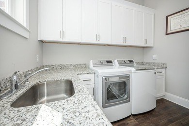 Welcome to this stunning custom-built home in the highly - photo 30