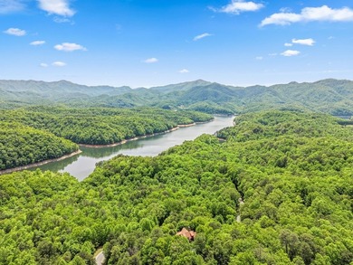 Perched within the sought-after gated community of Fontana Lake - photo 3