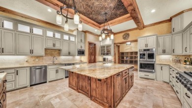 Welcome to 117 Hansma Way, a breathtaking custom ranch estate in