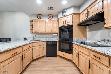 A rare single-story townhome in the gated Promenade at the