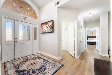 A rare single-story townhome in the gated Promenade at the