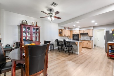 A rare single-story townhome in the gated Promenade at the