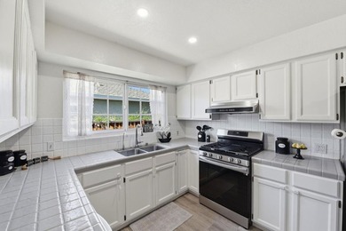 New Lower Price! This must see charming 3 bedroom, one and a - photo 9