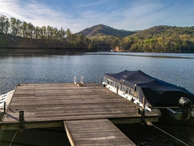 Nestled on a private cove of pristine Bear Creek Lake in the - photo 8