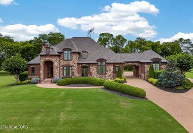 This beautiful stone-and-brick Tuscan-inspired home in the gated - photo 1