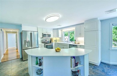 Perched atop a hillside along a winding drive, this one level - photo 22