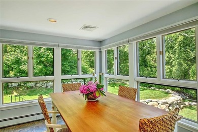 Perched atop a hillside along a winding drive, this one level - photo 29