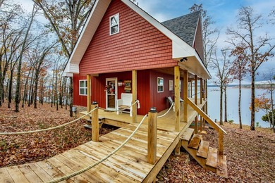 This incredible LAKE HOME, just a little over a year old, offers - photo 2