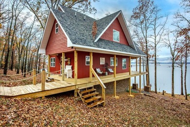 This incredible LAKE HOME, just a little over a year old, offers - photo 3