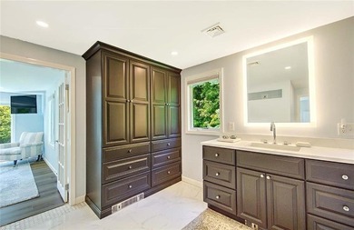 Perched atop a hillside along a winding drive, this one level - photo 36