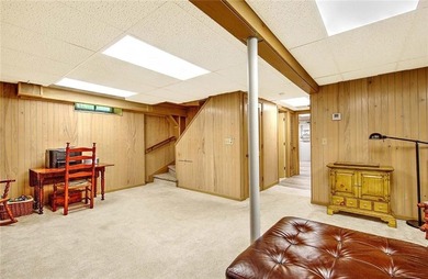 Perched atop a hillside along a winding drive, this one level - photo 42