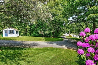 Perched atop a hillside along a winding drive, this one level - photo 46