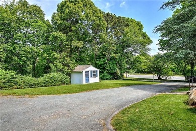 Perched atop a hillside along a winding drive, this one level - photo 48