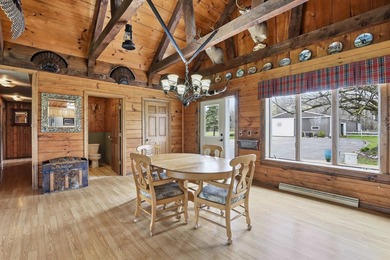 Step inside this rare beauty featuring vaulted ceilings, exposed - photo 11