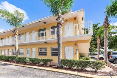 Discover a chic 2-bedroom, 1-bath corner unit condo with - photo 1