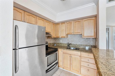 Discover a chic 2-bedroom, 1-bath corner unit condo with - photo 3