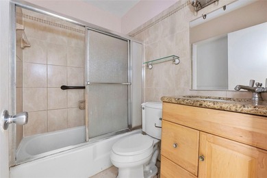 Discover a chic 2-bedroom, 1-bath corner unit condo with - photo 8
