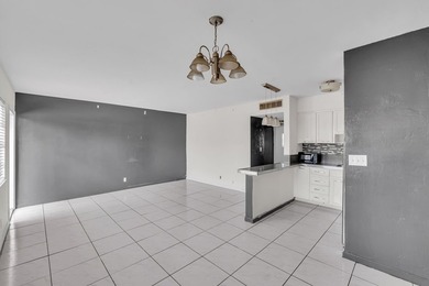 Discover a chic 2-bedroom, 1-bath corner unit condo with - photo 2