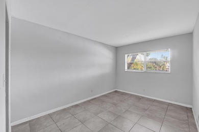 Discover a chic 2-bedroom, 1-bath corner unit condo with - photo 5