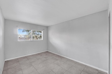 Discover a chic 2-bedroom, 1-bath corner unit condo with - photo 8
