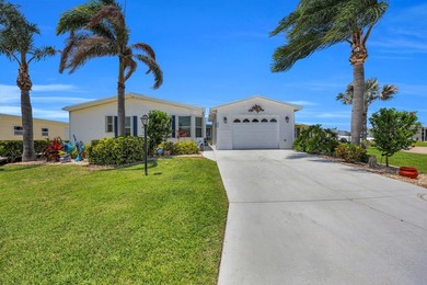 LAND OWNED 2/2 with rare 1 car garage! Nestled on a on a quiet - photo 1