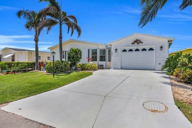 LAND OWNED 2/2 with rare 1 car garage! Nestled on a on a quiet - photo 2