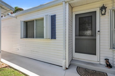 LAND OWNED 2/2 with rare 1 car garage! Nestled on a on a quiet - photo 4