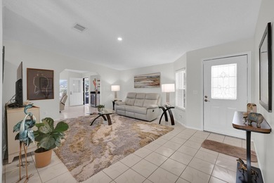 LAND OWNED 2/2 with rare 1 car garage! Nestled on a on a quiet - photo 5