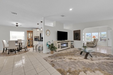 LAND OWNED 2/2 with rare 1 car garage! Nestled on a on a quiet - photo 6