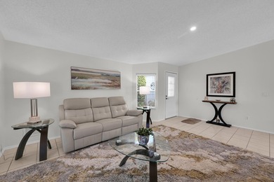 LAND OWNED 2/2 with rare 1 car garage! Nestled on a on a quiet - photo 7
