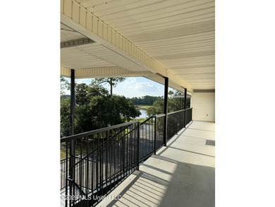 Maintenance free coastal living at its finest! This is a one - photo 9