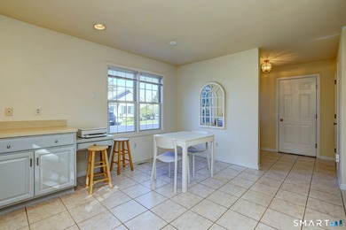 This gorgeous, sun-splashed end-unit townhouse-originally the