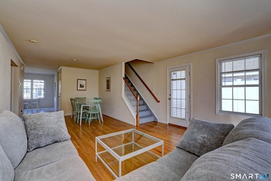 This gorgeous, sun-splashed end-unit townhouse-originally the