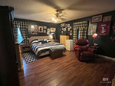 Nestled on the outskirts of Fairhope, this appealing