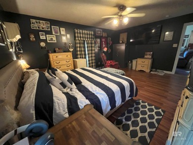 Nestled on the outskirts of Fairhope, this appealing