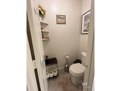 Nestled on the outskirts of Fairhope, this appealing