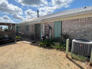 Nestled on the outskirts of Fairhope, this appealing