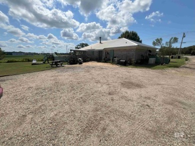 Nestled on the outskirts of Fairhope, this appealing