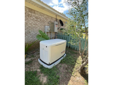 Nestled on the outskirts of Fairhope, this appealing