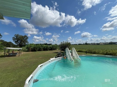 Nestled on the outskirts of Fairhope, this appealing