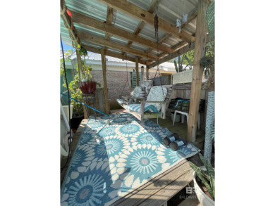 Nestled on the outskirts of Fairhope, this appealing