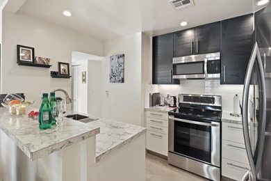 Welcome to this beautifully RENOVATED second-floor condo - photo 4