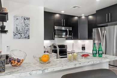 Welcome to this beautifully RENOVATED second-floor condo - photo 6